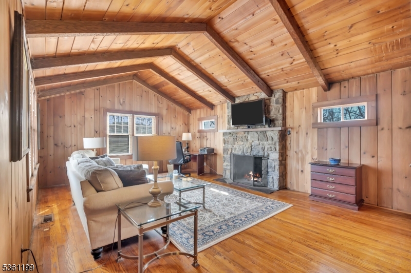 1595 Highway 206 Bedminster, NJ 07921 - Photo 8 of 24 a living room with furniture a fireplace and a flat screen tv