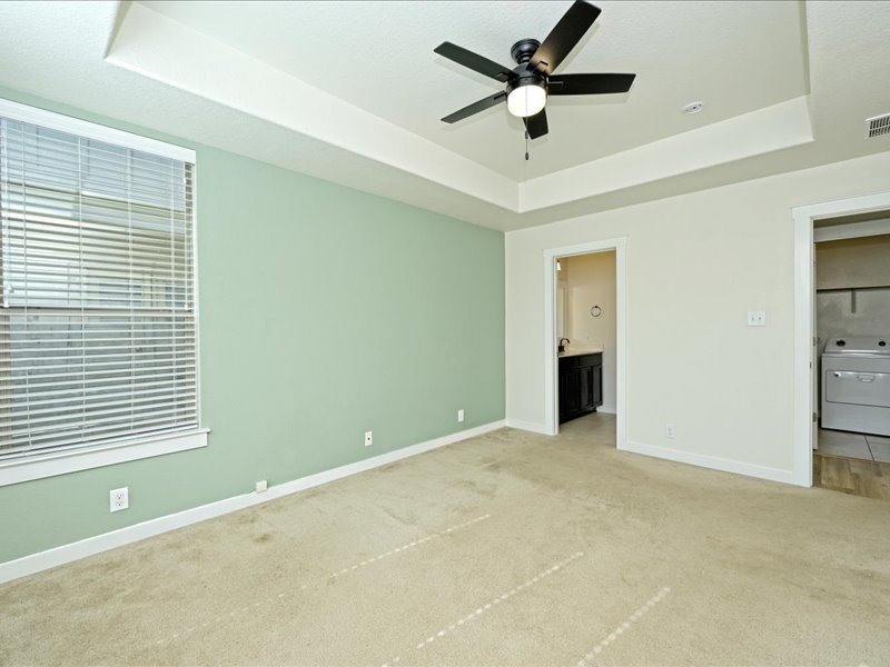 2101 Rivers Edge Way, Unit 29 Austin, TX 78741 - Photo 16 of 38 Large main floor primary suite tucked away