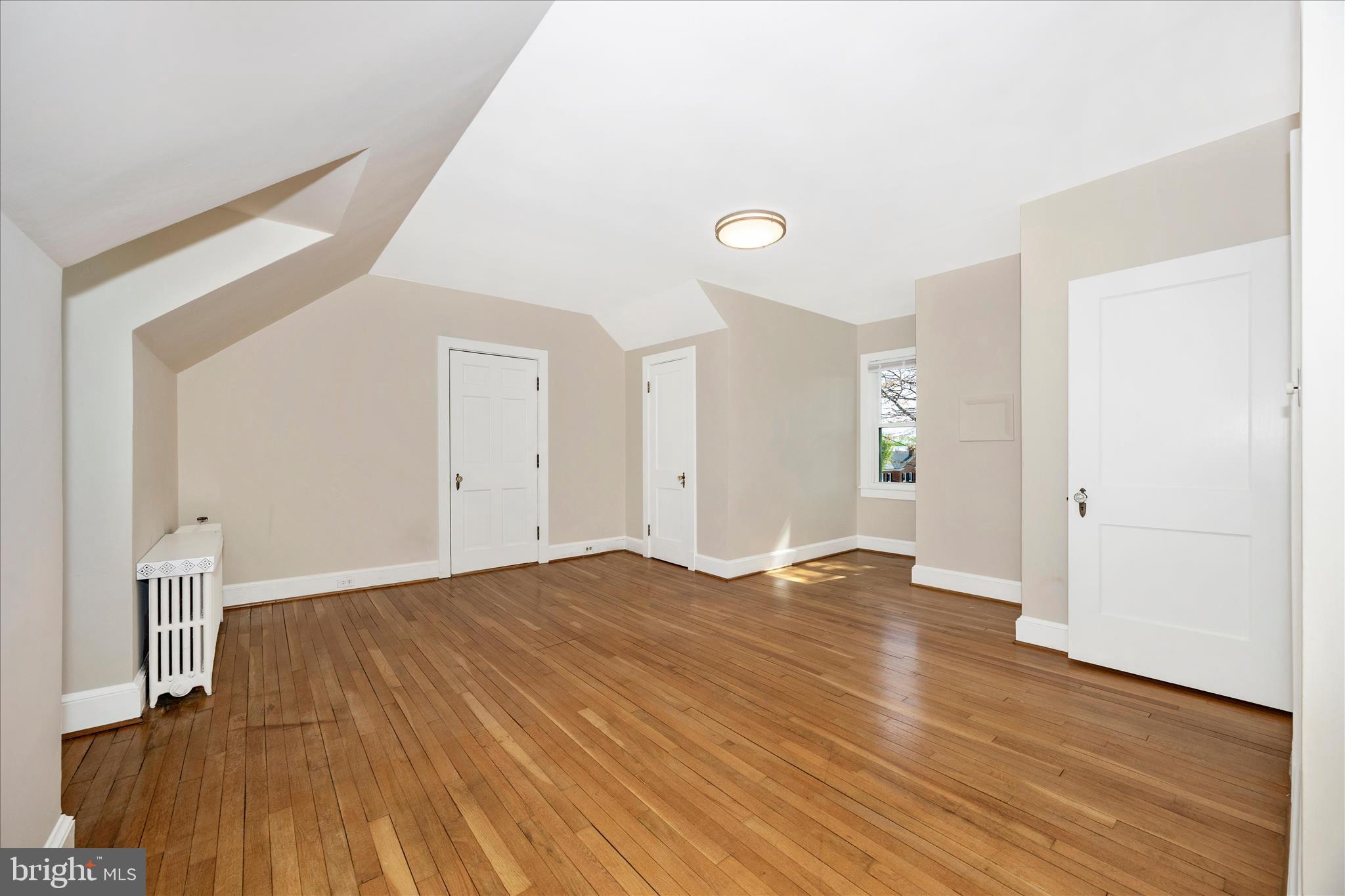 2 Catoctin Avenue Frederick, MD 21701 - Photo 21 of 63 a view of empty room with wooden floor and fan