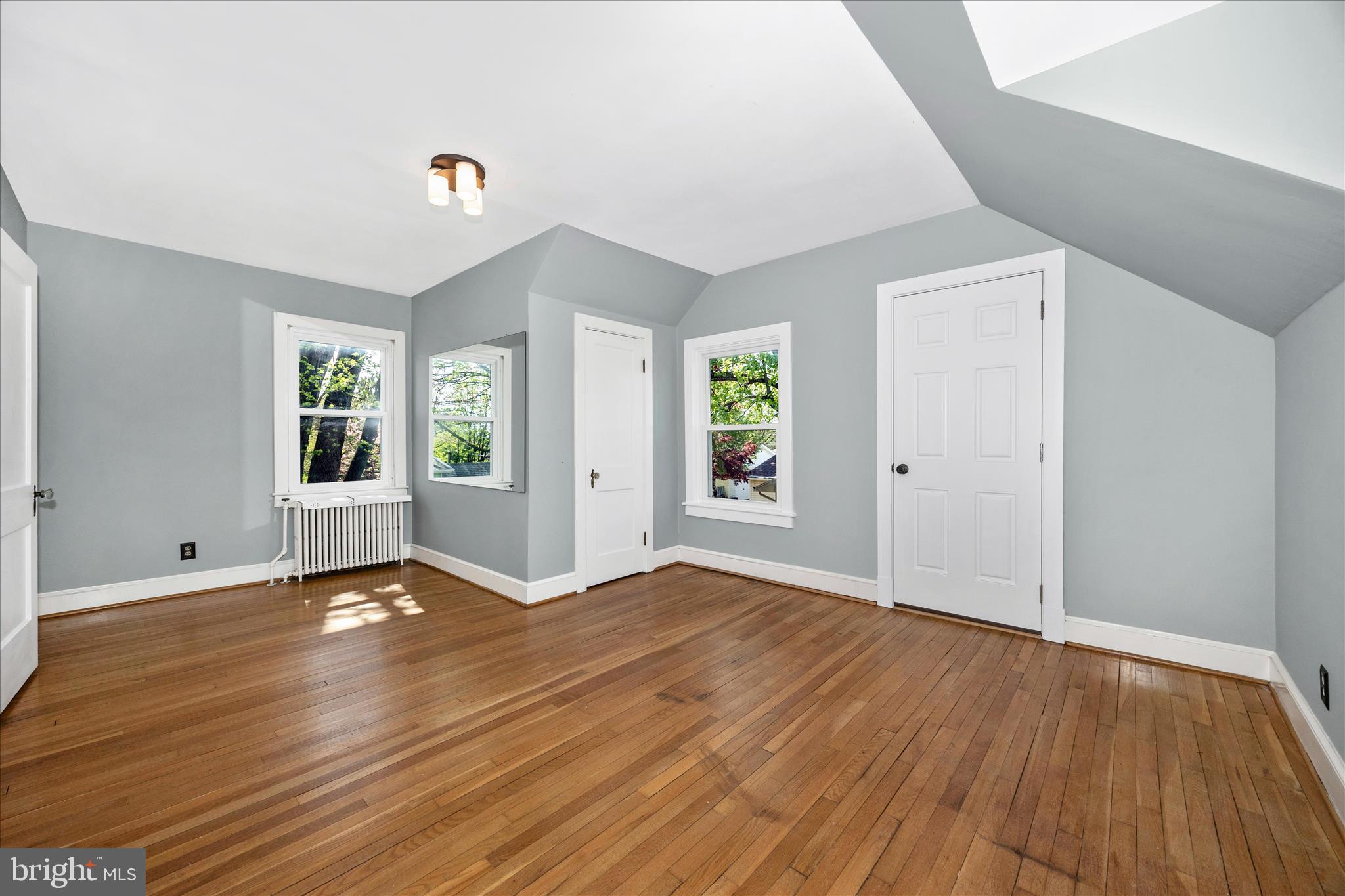 2 Catoctin Avenue Frederick, MD 21701 - Photo 26 of 63 an empty room with wooden floor and windows