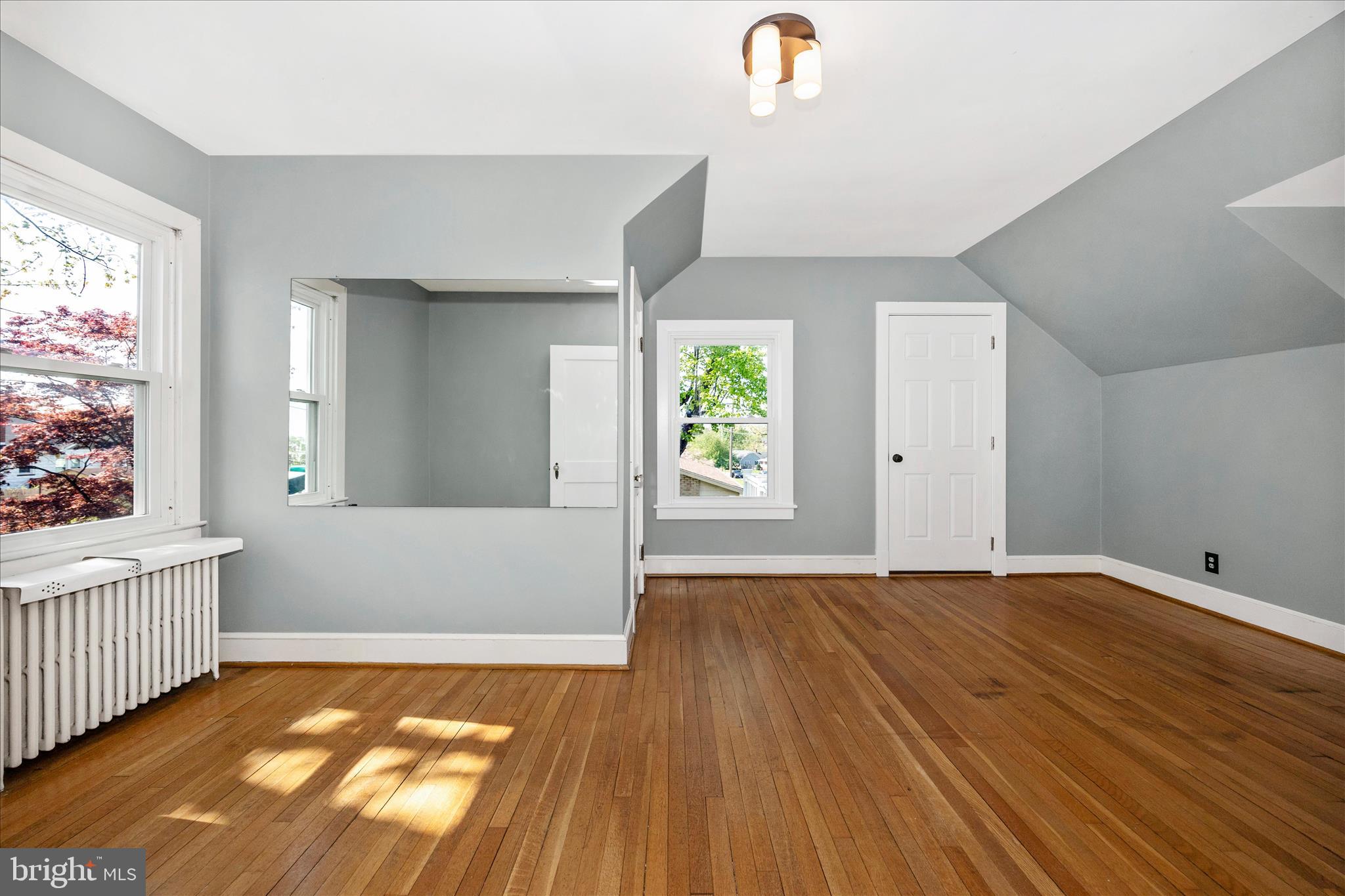 2 Catoctin Avenue Frederick, MD 21701 - Photo 29 of 63 wooden floor in an empty room with a window