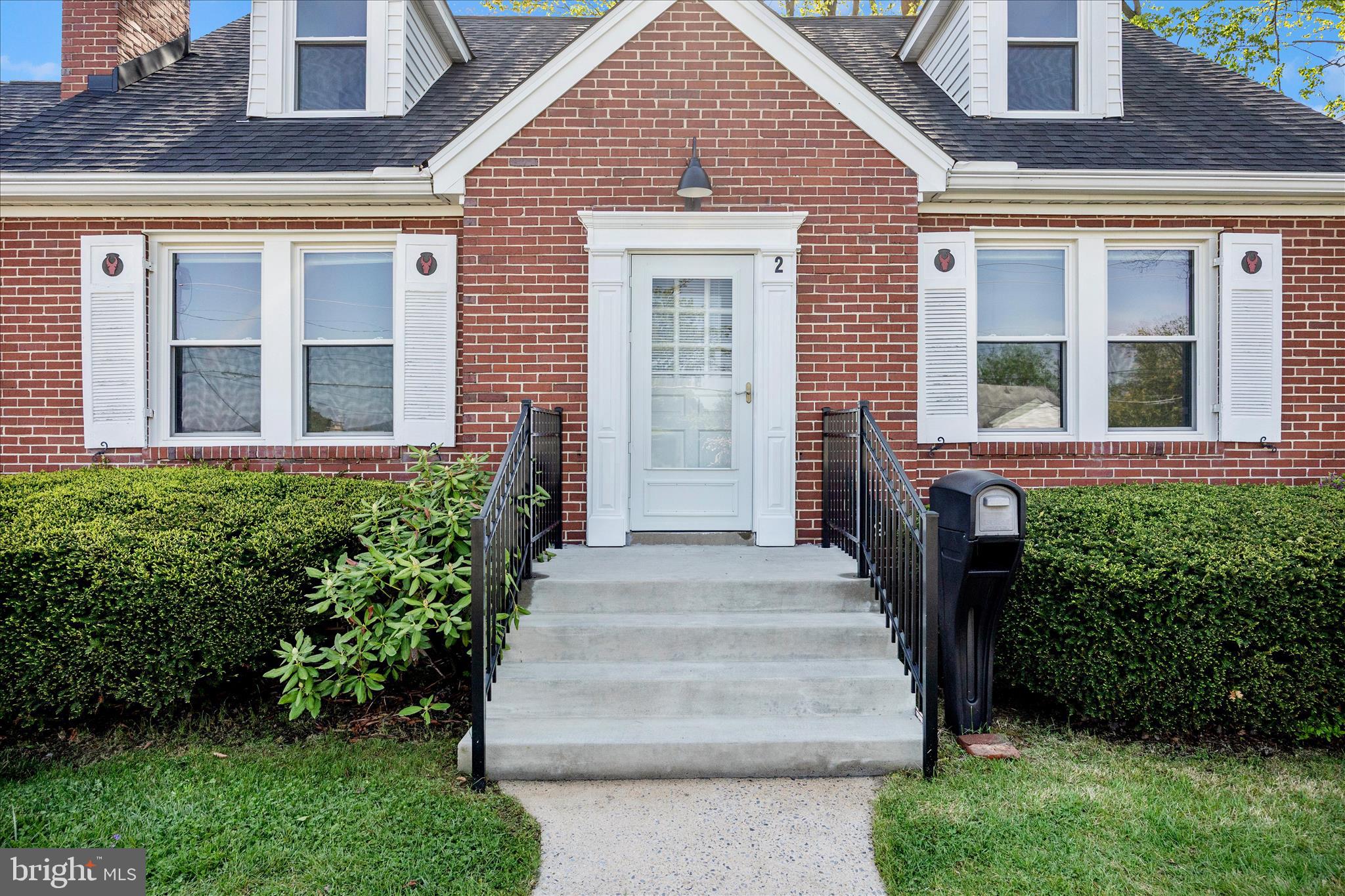 2 Catoctin Avenue Frederick, MD 21701 - Photo 3 of 63 a front view of a house with a garden