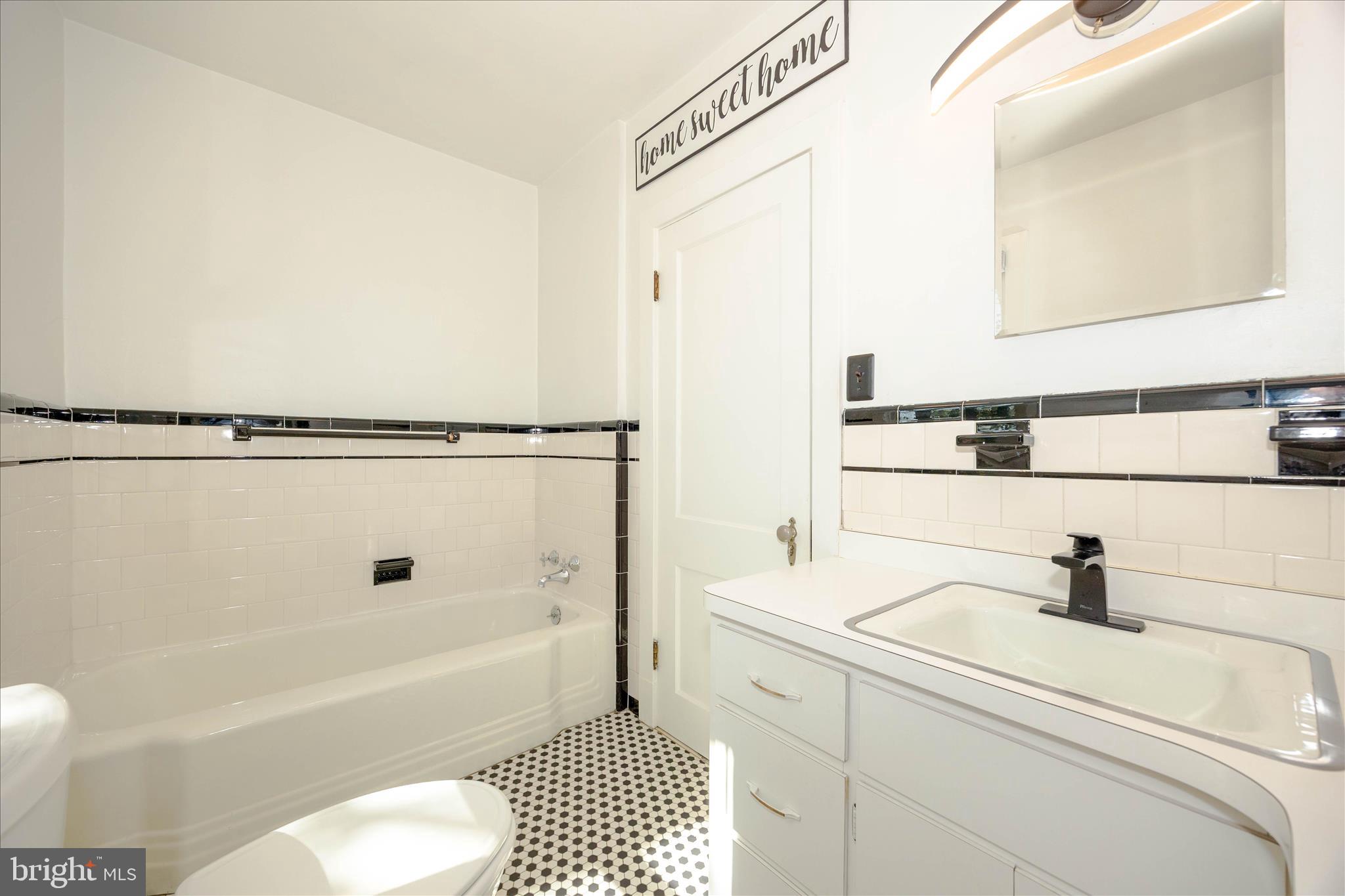 2 Catoctin Avenue Frederick, MD 21701 - Photo 33 of 63 a bathroom with a sink a toilet and shower