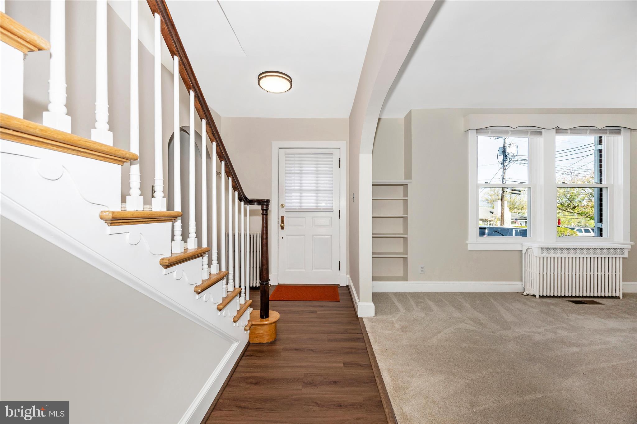 2 Catoctin Avenue Frederick, MD 21701 - Photo 4 of 63 a view of an entryway with wooden floor and stairs