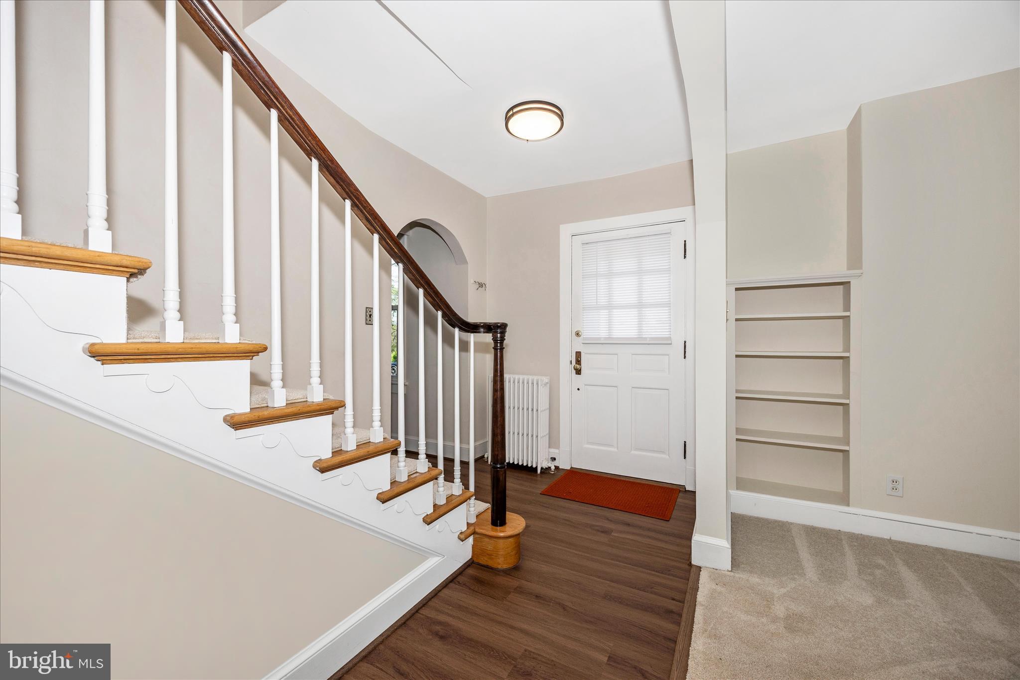 2 Catoctin Avenue Frederick, MD 21701 - Photo 5 of 63 a view of front door with hallway and wooden floor