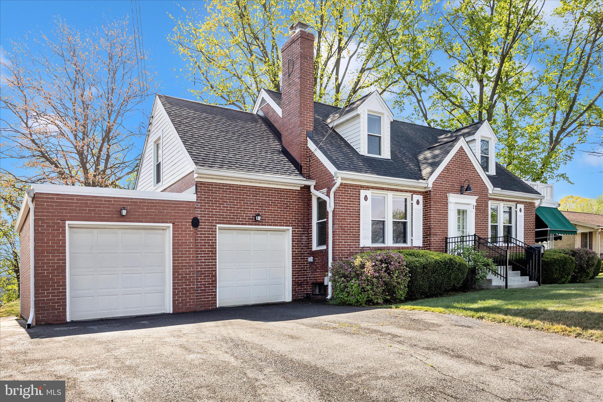 2 Catoctin Avenue Frederick, MD 21701 - Photo 57 of 63 a front view of a house with a garden