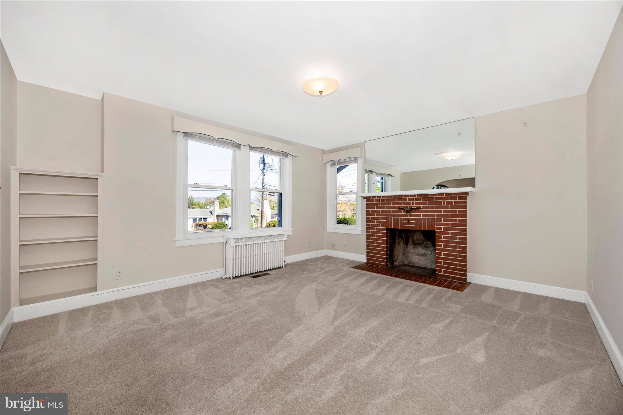 2 Catoctin Avenue Frederick, MD 21701 - Photo 7 of 63 an empty room with furniture and a fireplace