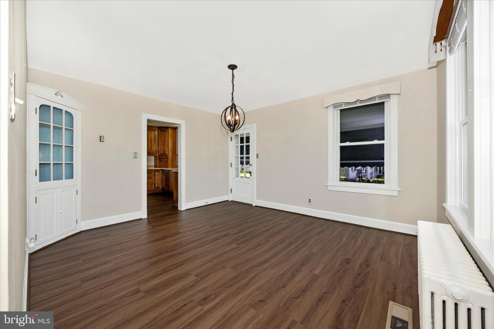 2 Catoctin Avenue Frederick, MD 21701 - Photo 10 of 63 an empty room with wooden floor and windows