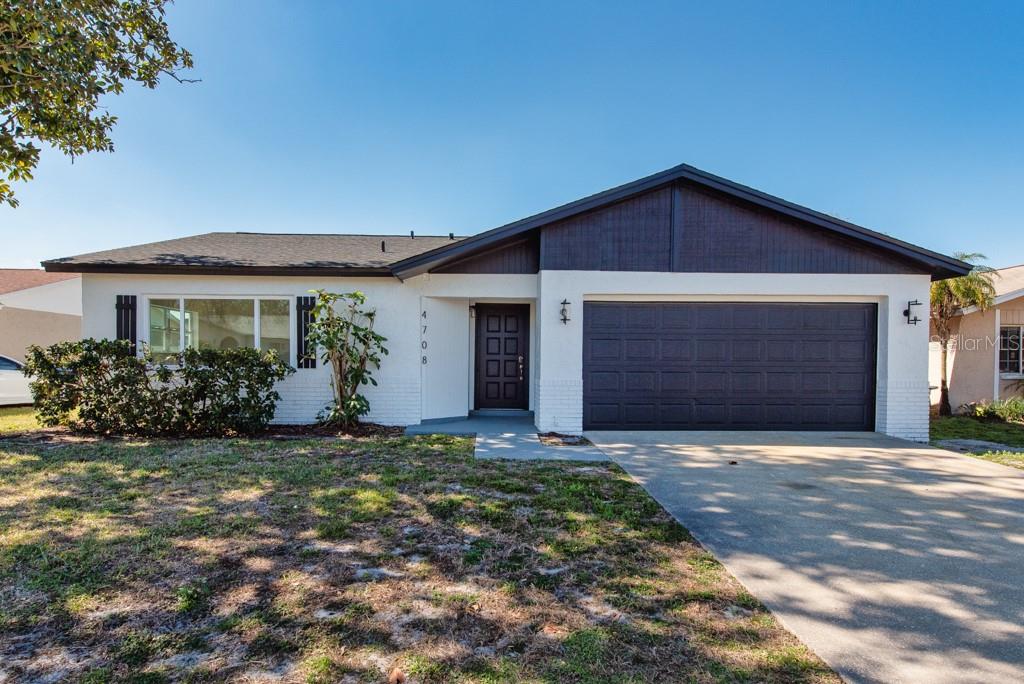 4708 Cypress Ridge Place Tampa, FL 33624 - Photo 1 of 1 a front view of a house with a yard