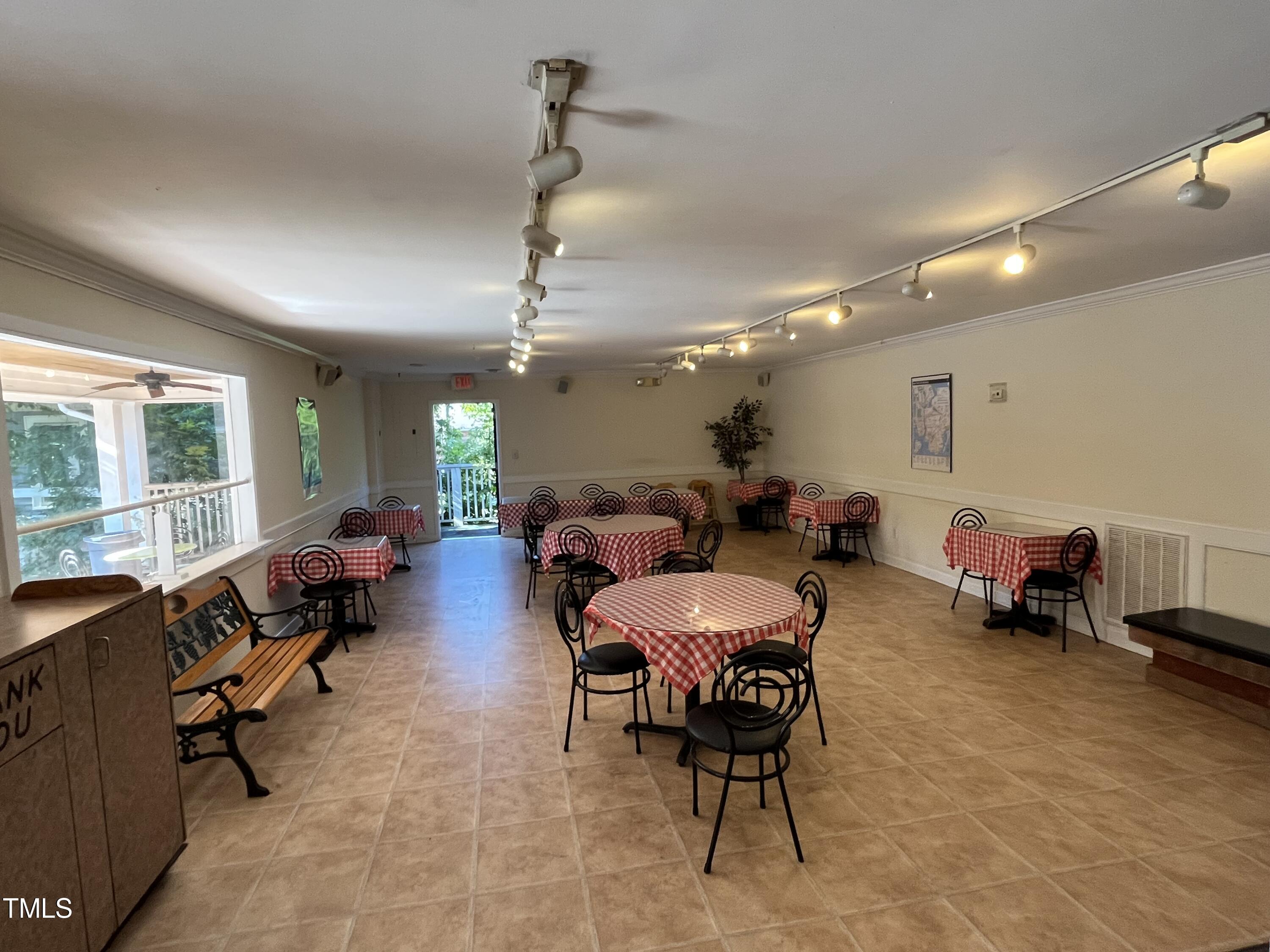 2300 Chapel Hill Road Durham, NC 27707 - Photo 2 of 8 a living room with furniture and a chandelier