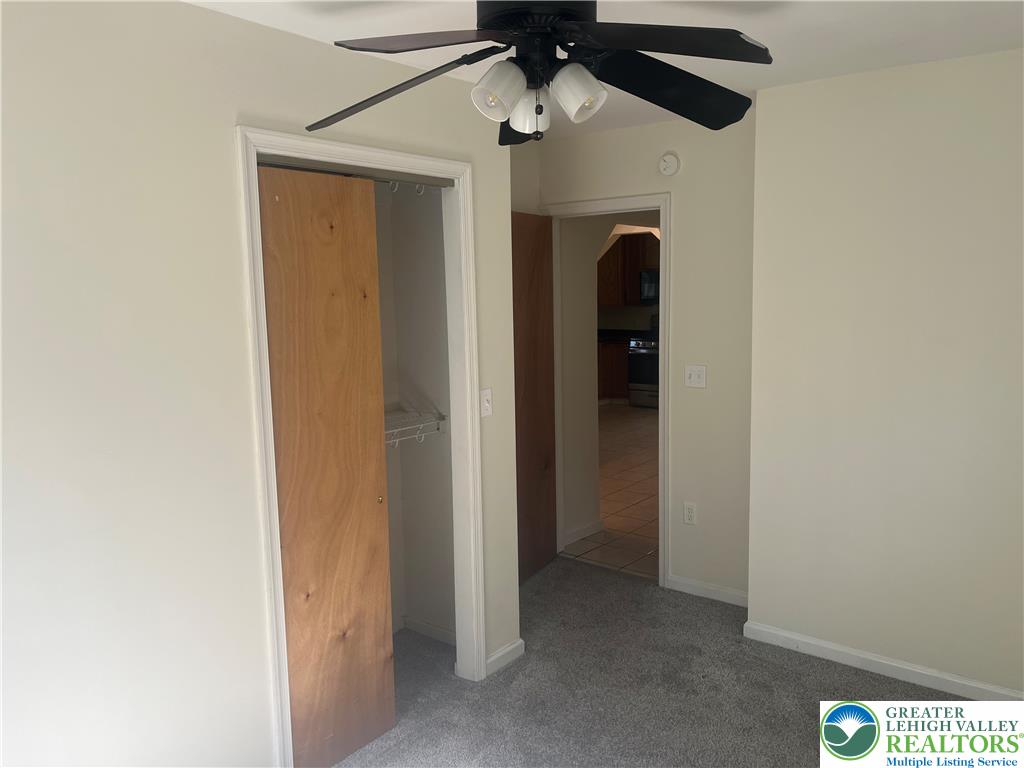 1839 Willow Park Road Bethlehem, PA 18020 - Photo 14 of 35 Relax in this well-lit bedroom featuring soft carpeting and a convenient ceiling fan.