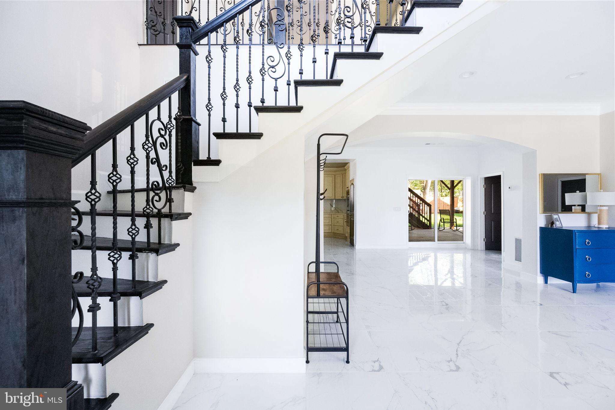 6709 Benson Drive Alexandria, VA 22306 - Photo 13 of 66 a view of entryway and hall with wooden floor