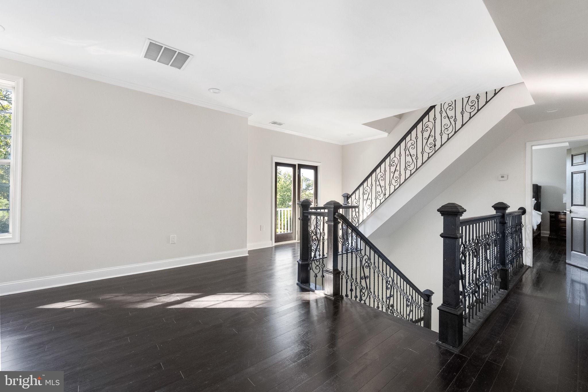 6709 Benson Drive Alexandria, VA 22306 - Photo 27 of 66 a view of entryway and hall with wooden floor