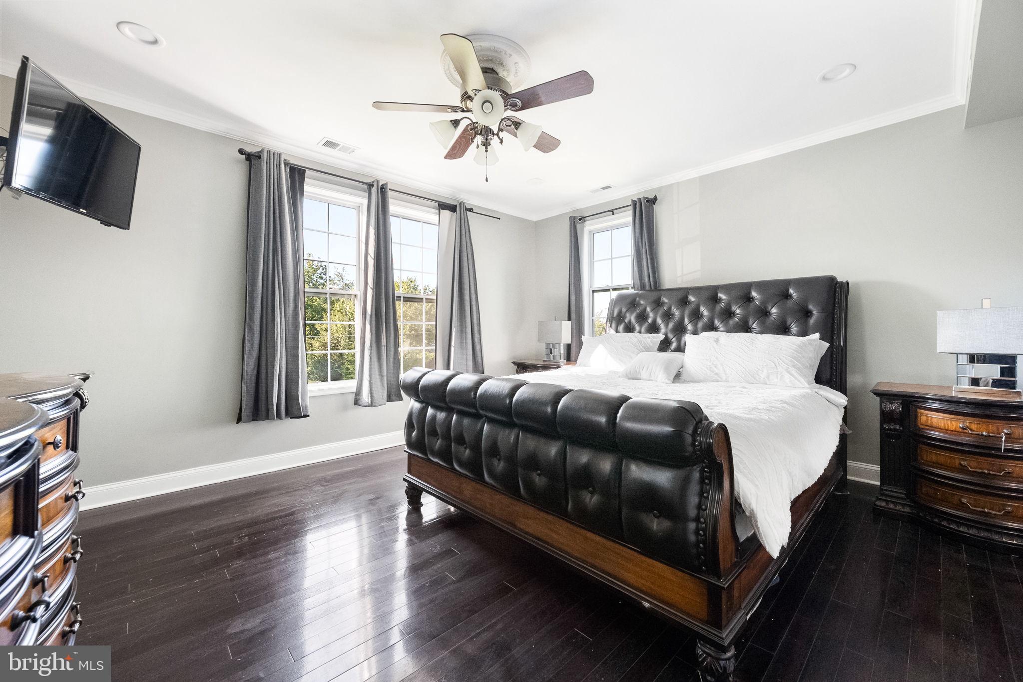 6709 Benson Drive Alexandria, VA 22306 - Photo 30 of 66 a bedroom with a bed a window and a flat screen tv