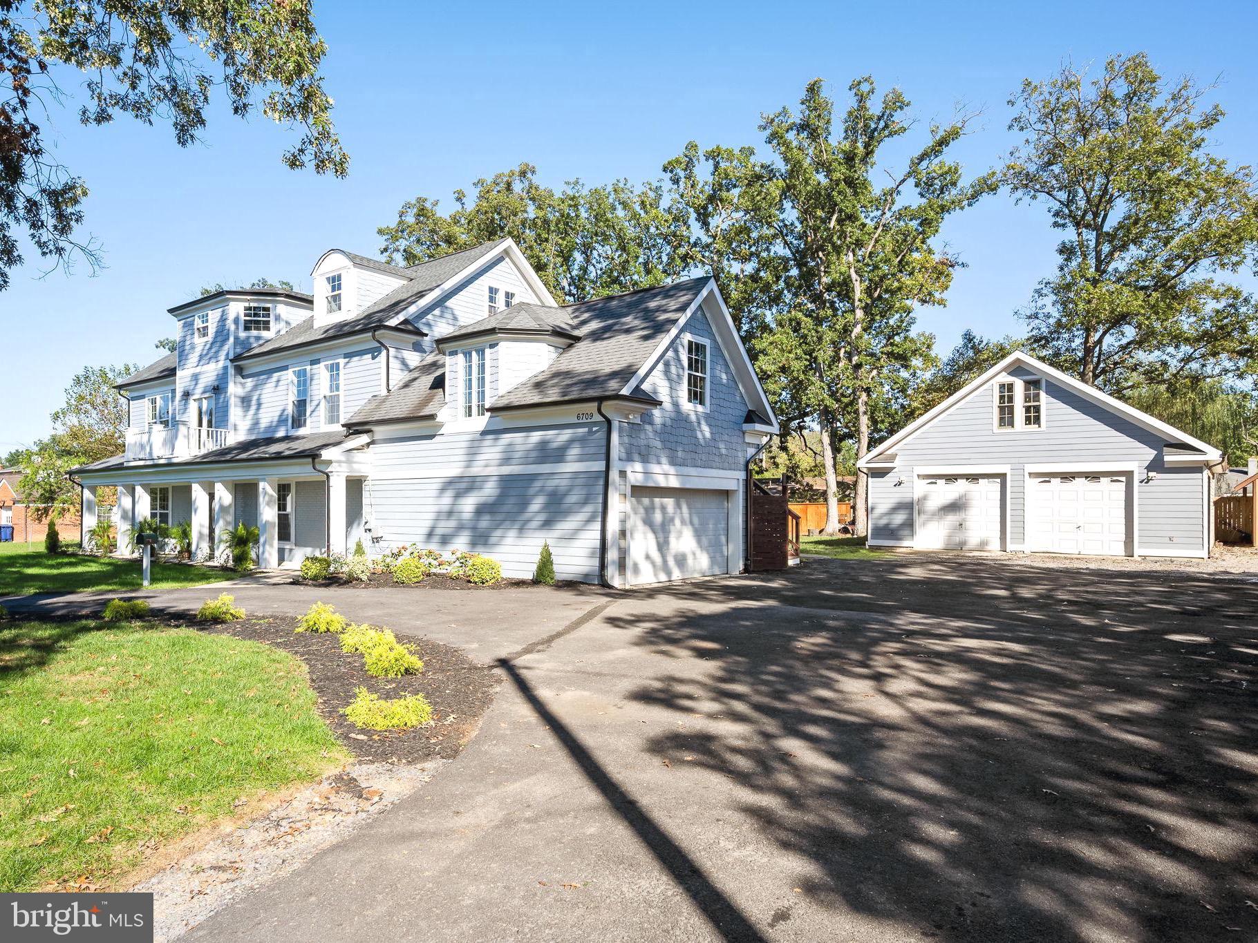 6709 Benson Drive Alexandria, VA 22306 - Photo 3 of 66 a view of a big house with a big yard and large tree
