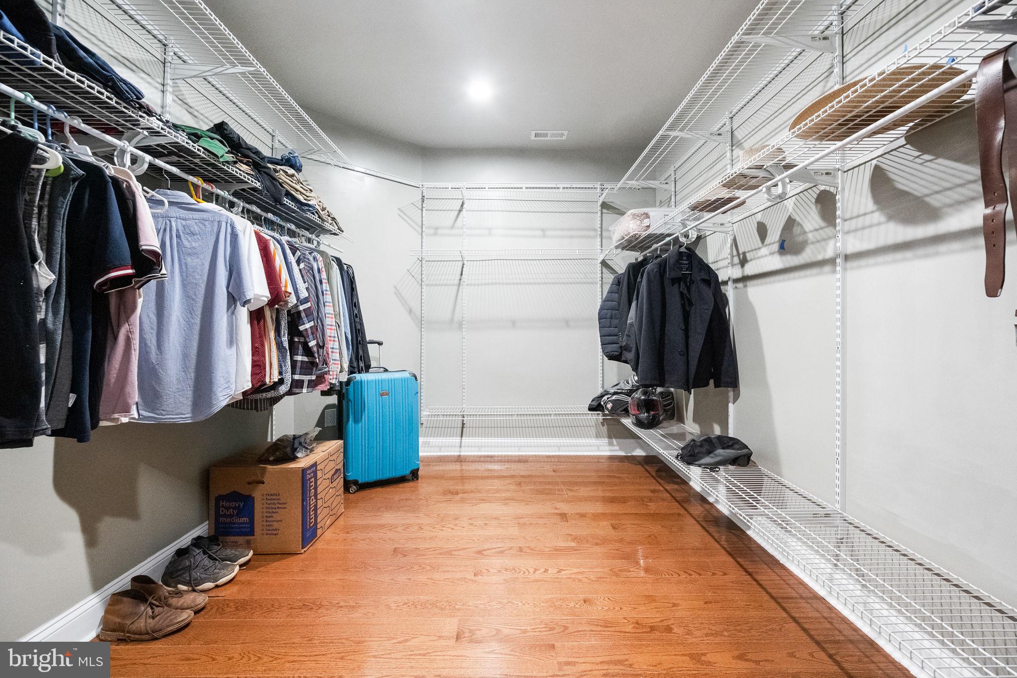 6709 Benson Drive Alexandria, VA 22306 - Photo 37 of 66 a view of walk in closet with clothes and shoes