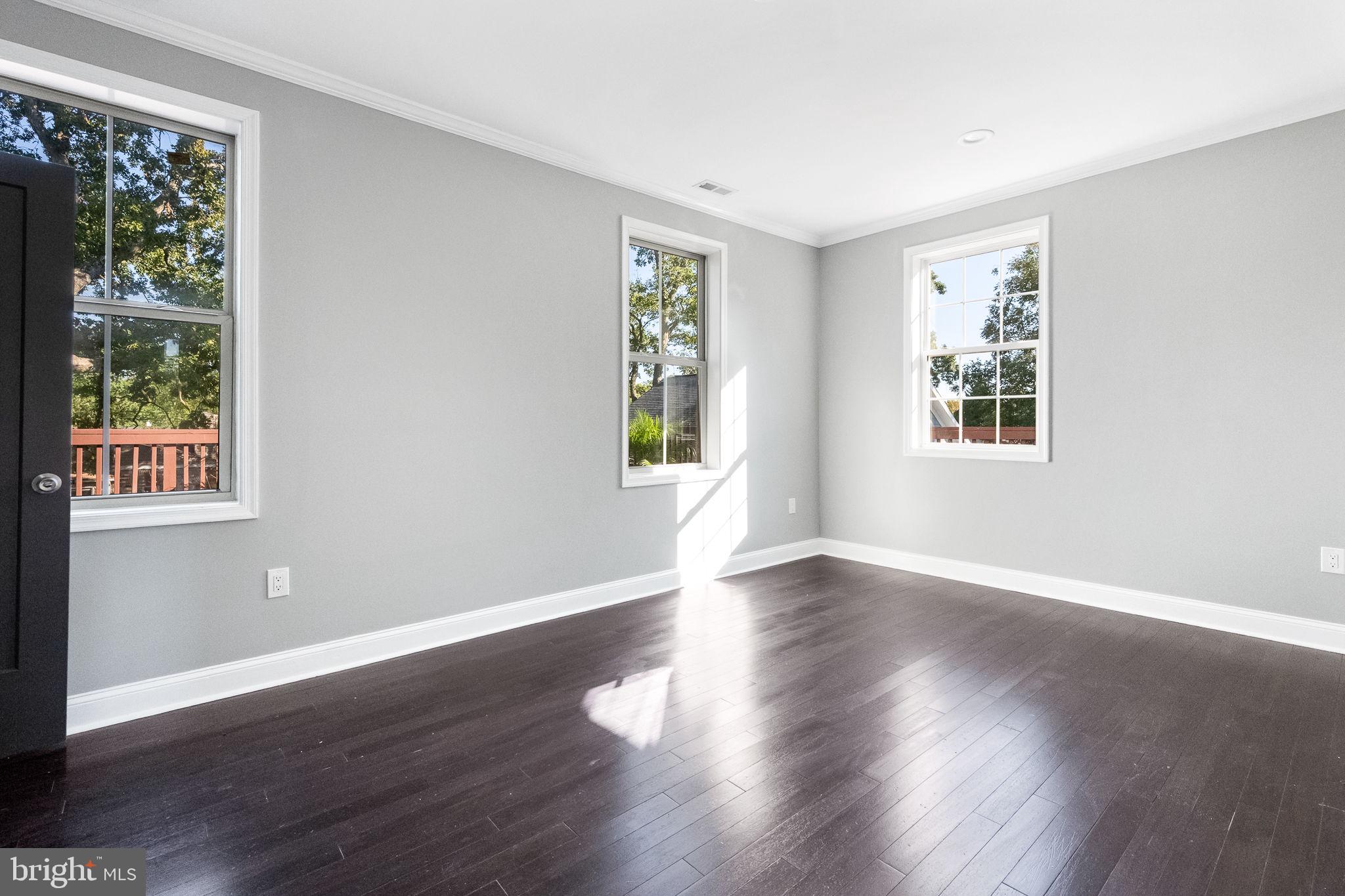 6709 Benson Drive Alexandria, VA 22306 - Photo 41 of 66 a view of an empty room with wooden floor and a window