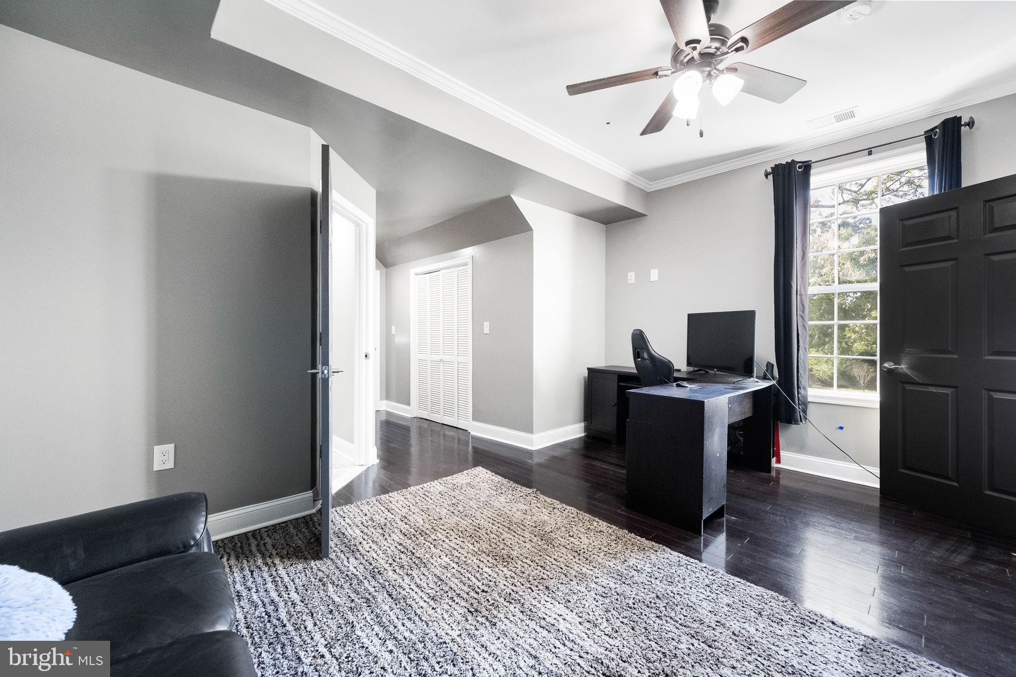 6709 Benson Drive Alexandria, VA 22306 - Photo 42 of 66 a bedroom with a bed and a television
