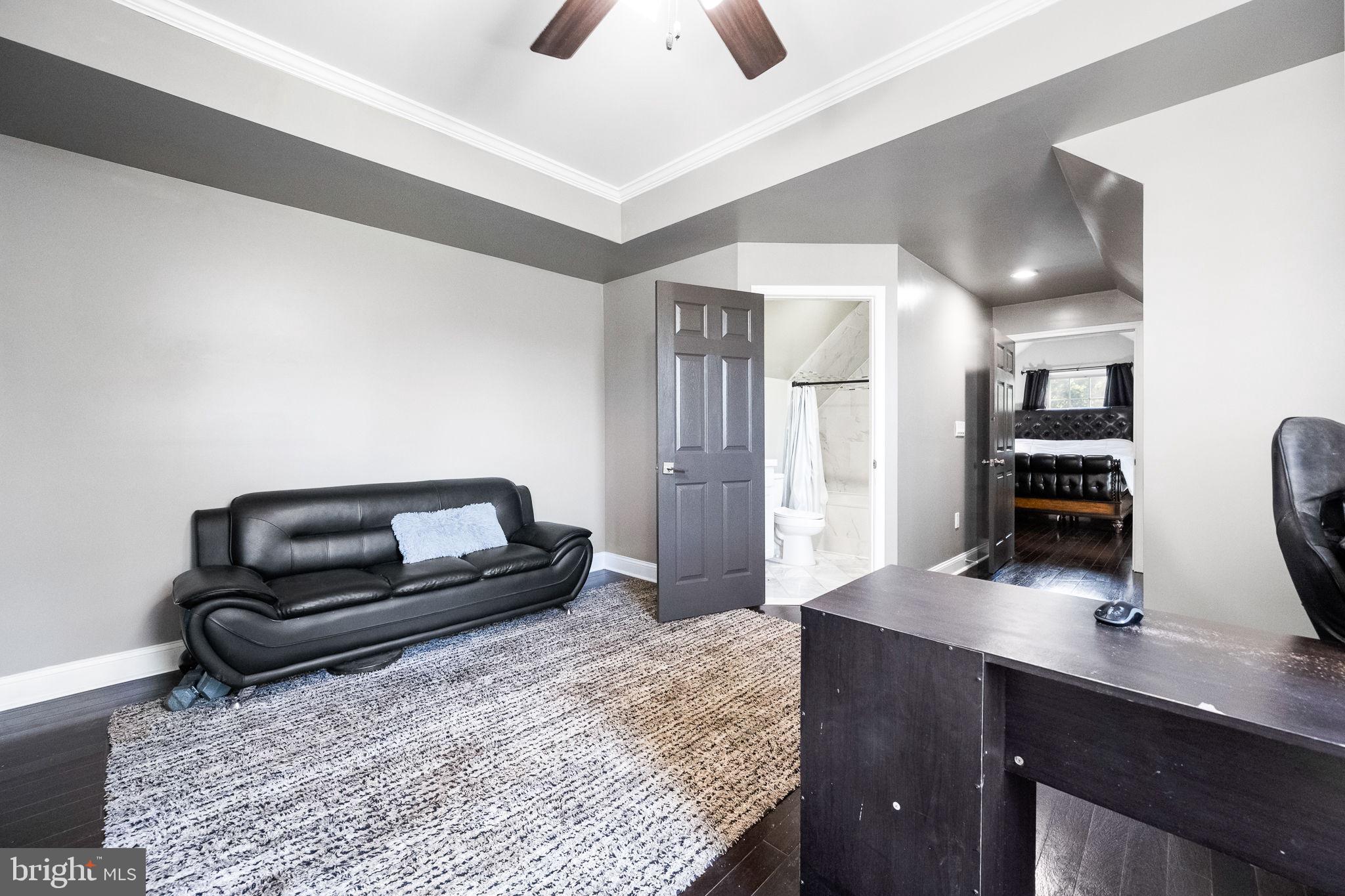 6709 Benson Drive Alexandria, VA 22306 - Photo 43 of 66 a bedroom with a bed and a couch