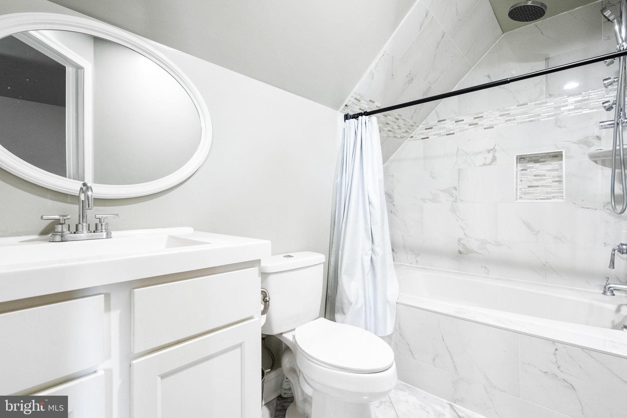 6709 Benson Drive Alexandria, VA 22306 - Photo 46 of 66 a bathroom with a sink toilet and shower