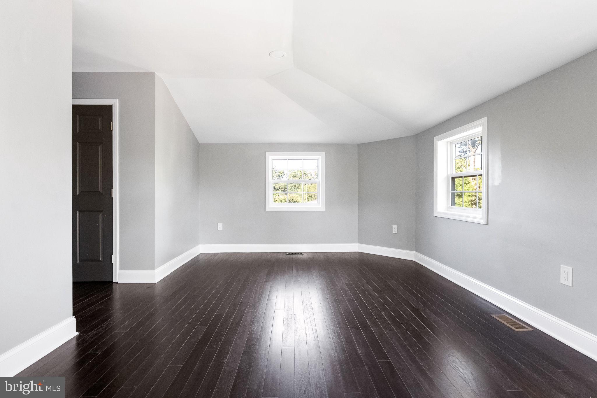 6709 Benson Drive Alexandria, VA 22306 - Photo 51 of 66 an empty room with wooden floor and windows