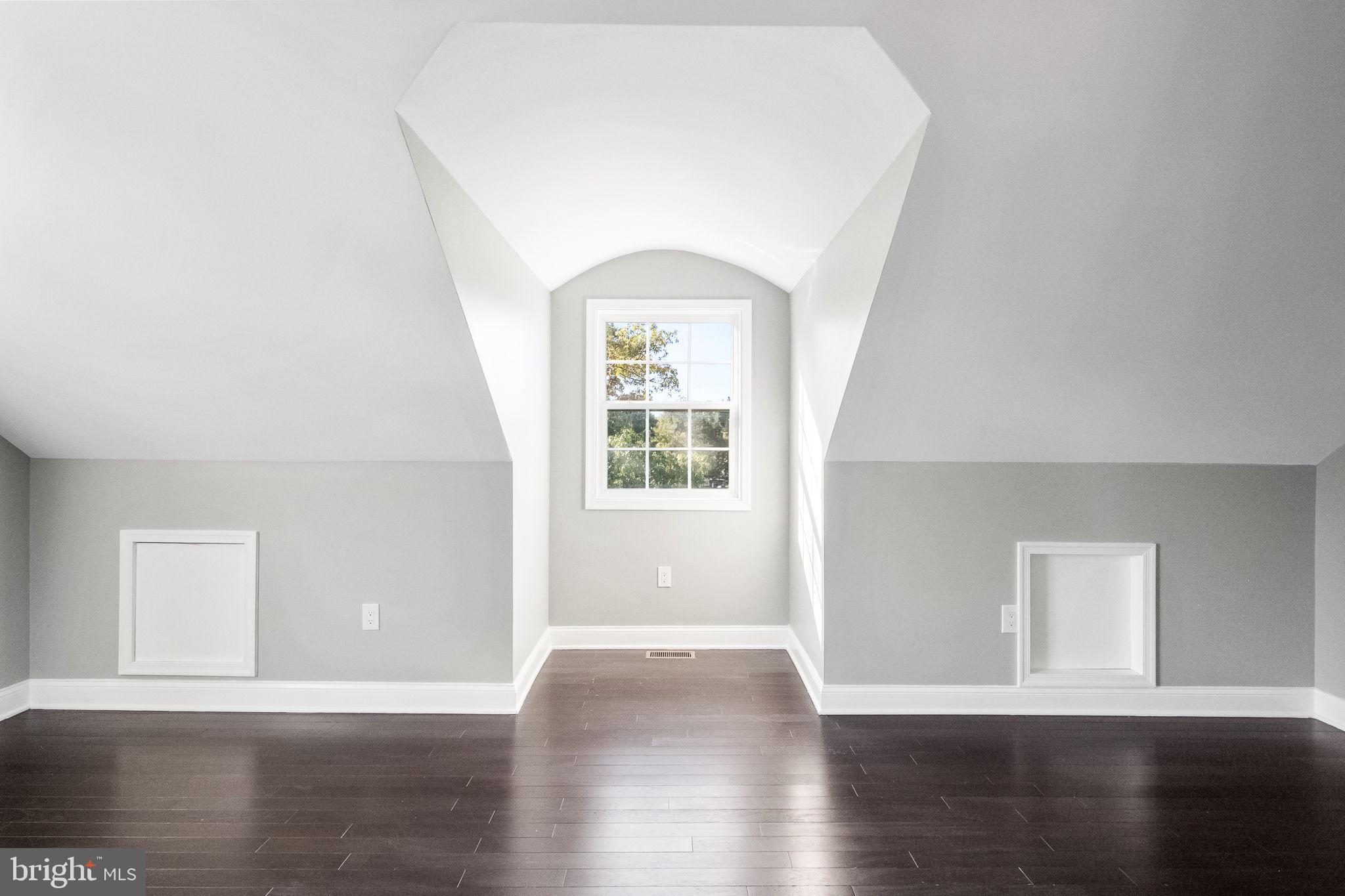 6709 Benson Drive Alexandria, VA 22306 - Photo 53 of 66 a view of an empty room with wooden floor and a window
