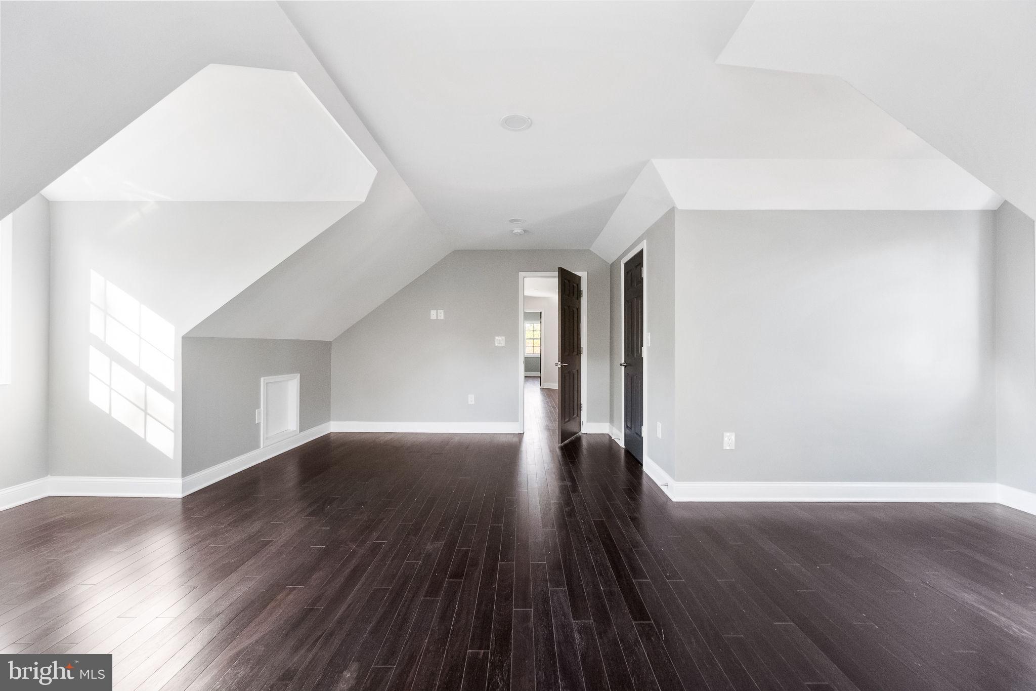 6709 Benson Drive Alexandria, VA 22306 - Photo 54 of 66 a view of an empty room with wooden floor and a window