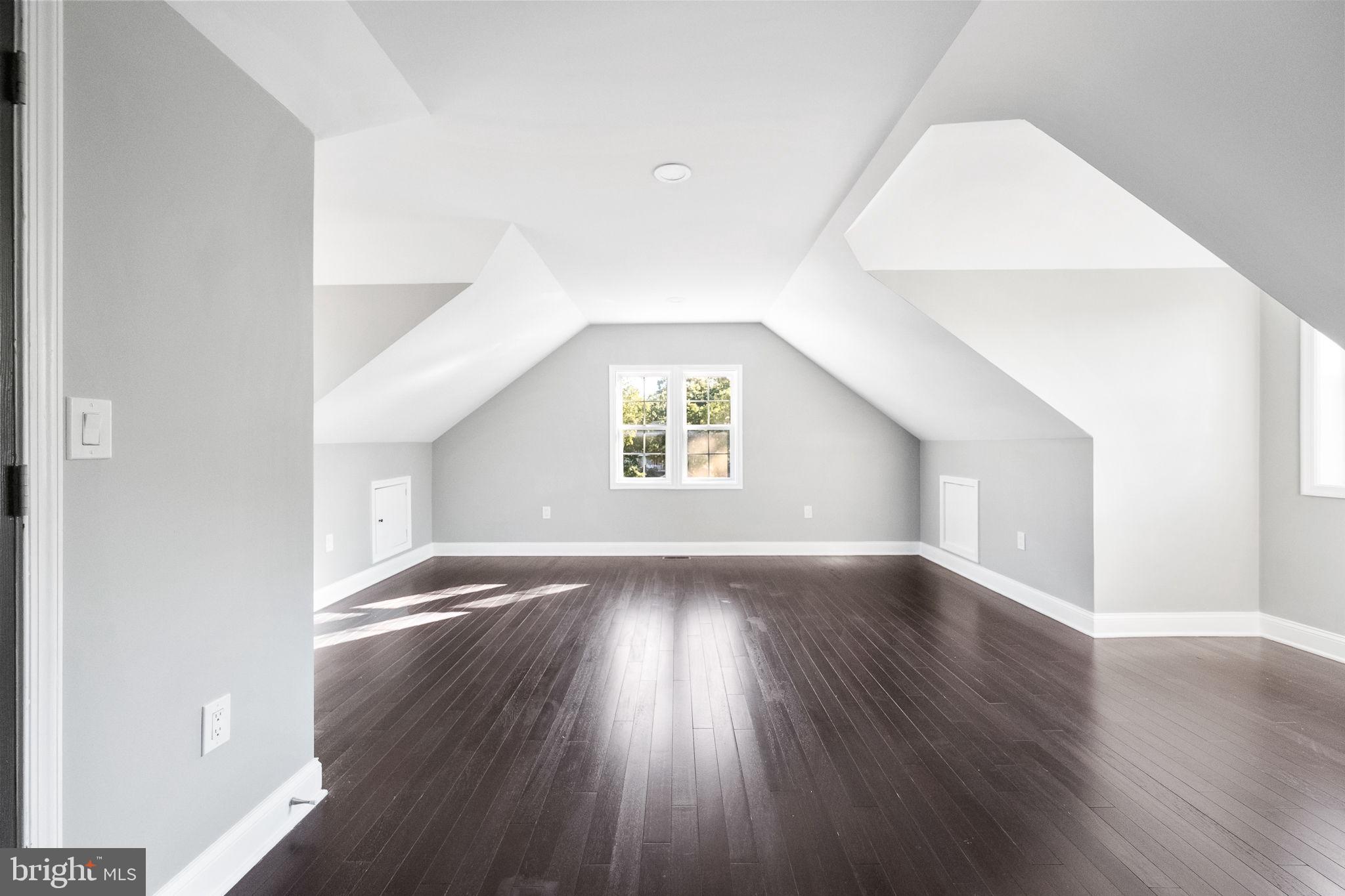 6709 Benson Drive Alexandria, VA 22306 - Photo 55 of 66 an empty room with wooden floor and windows