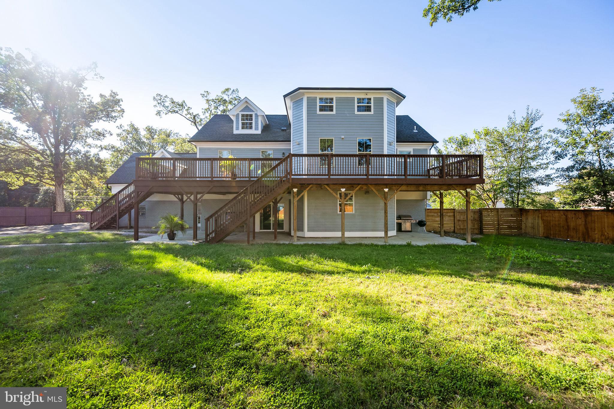 6709 Benson Drive Alexandria, VA 22306 - Photo 8 of 66 a view of a house with a big yard plants and large trees