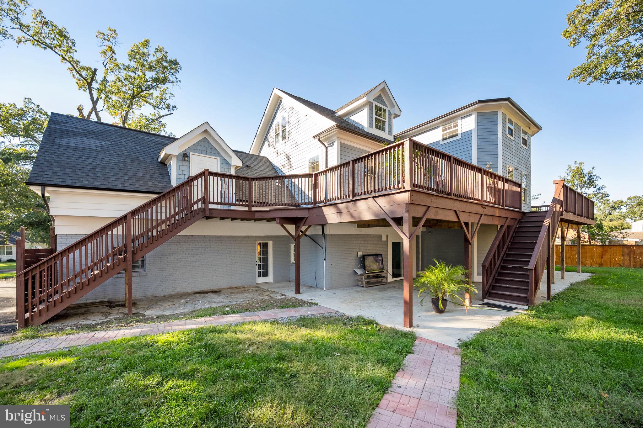 6709 Benson Drive Alexandria, VA 22306 - Photo 10 of 66 a view of a big house with wooden fence and two windows