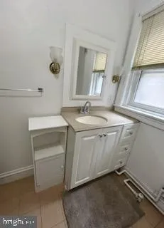a utility room with a sink washer and dryer