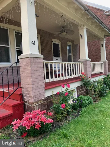 a flower plants in front of a house