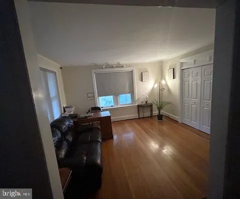 a view of a livingroom with furniture and a window