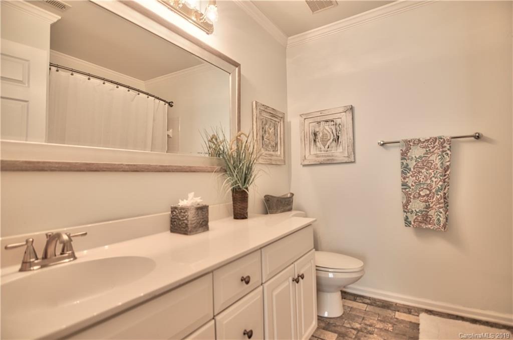 20210 Bascom Ridge Drive Cornelius, NC 28031 - Photo 23 of 35 a bathroom with a toilet sink and mirror