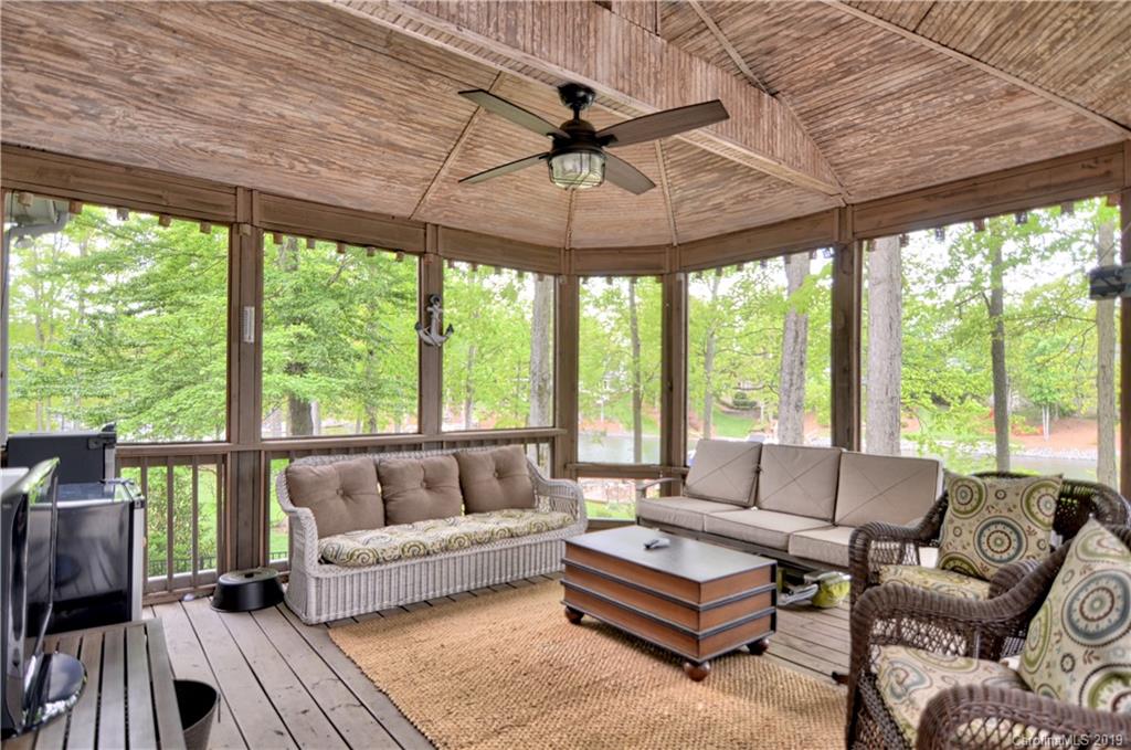 20210 Bascom Ridge Drive Cornelius, NC 28031 - Photo 24 of 35 a living room with furniture and a large window