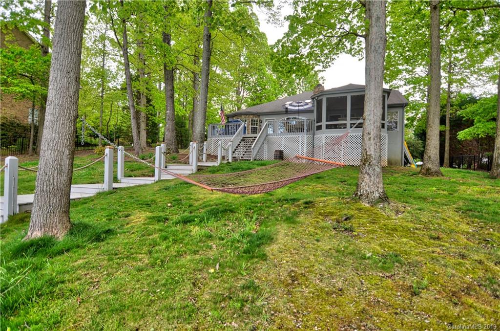 20210 Bascom Ridge Drive Cornelius, NC 28031 - Photo 29 of 35 a backyard of a house with seating space