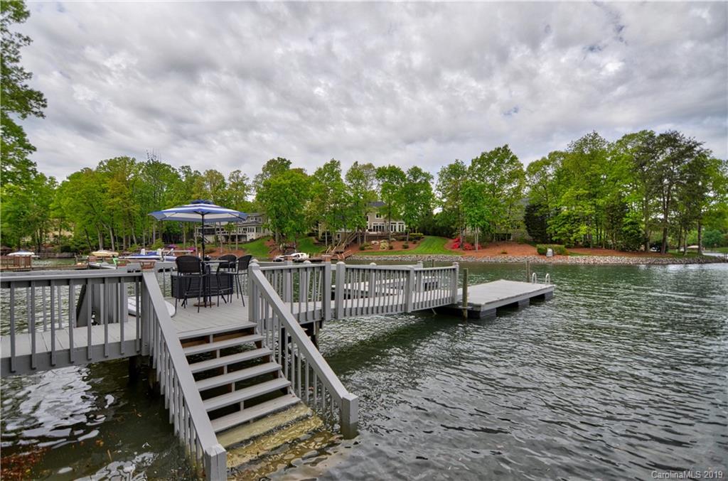20210 Bascom Ridge Drive Cornelius, NC 28031 - Photo 31 of 35 a view of a lake with sitting area
