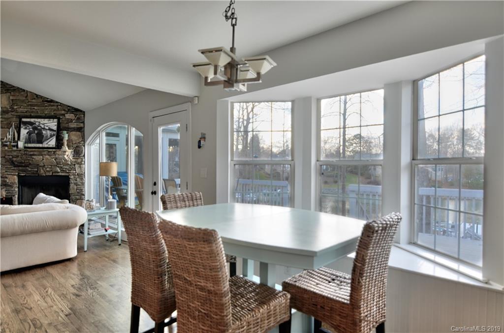 20210 Bascom Ridge Drive Cornelius, NC 28031 - Photo 9 of 35 a view of a dining room with furniture window and outside view
