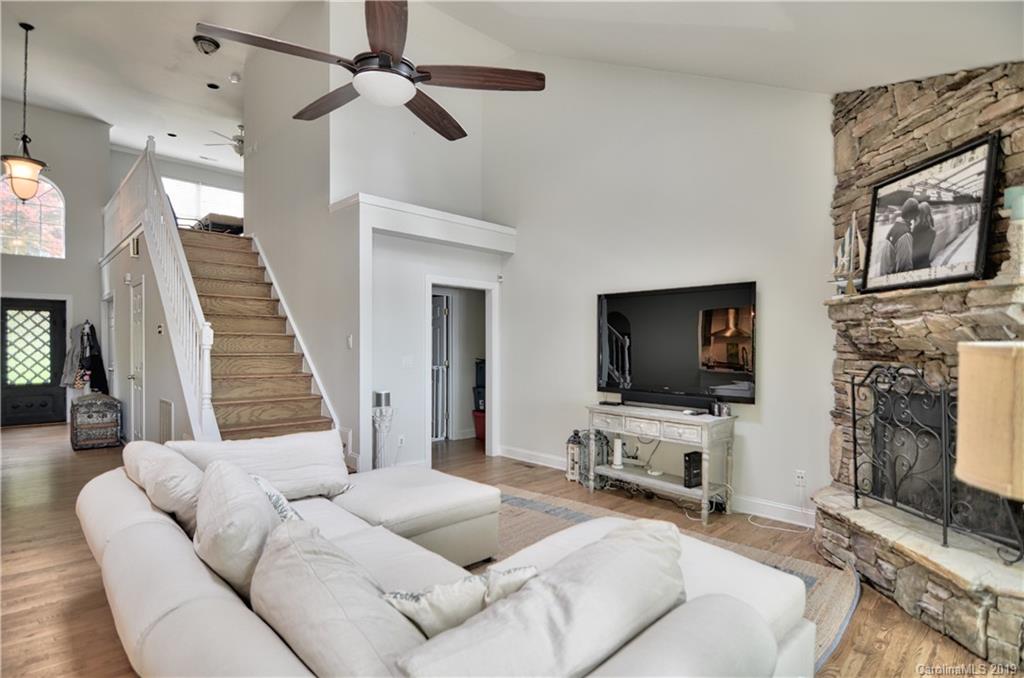 20210 Bascom Ridge Drive Cornelius, NC 28031 - Photo 10 of 35 a living room with furniture and a flat screen tv