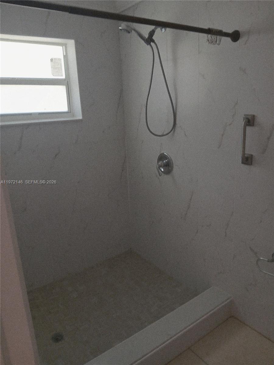 6471 Southwest 27th Street, Unit 2 Miramar, FL 33023 - Photo 24 of 41 a bathroom that has a shower on the wall