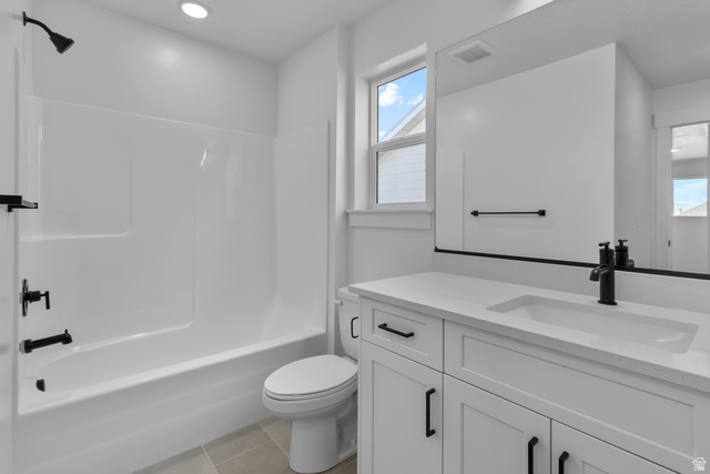 1213 West 500 South Logan, UT 84321 - Photo 22 of 29 Bathroom featuring a white vanity with an integrated sink, matte black fixtures, and a framed mirror
