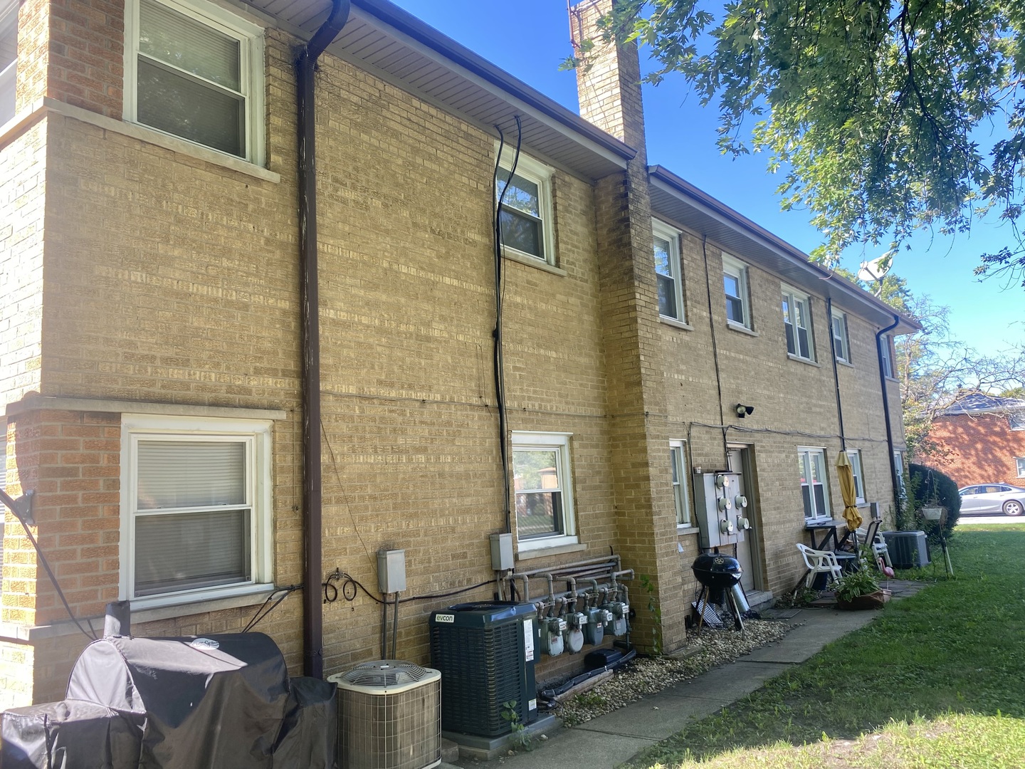 18231 Morgan Avenue, Unit 2N Homewood, IL 60430 - Photo 16 of 28 a front view of a house with outdoor seating