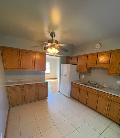 a kitchen with stainless steel appliances granite countertop a sink and cabinets