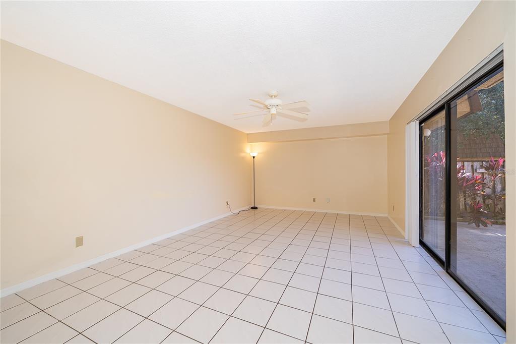 5258 Coral Court, Unit 605 Orlando, FL 32811 - Photo 11 of 41 a view of an empty room and window