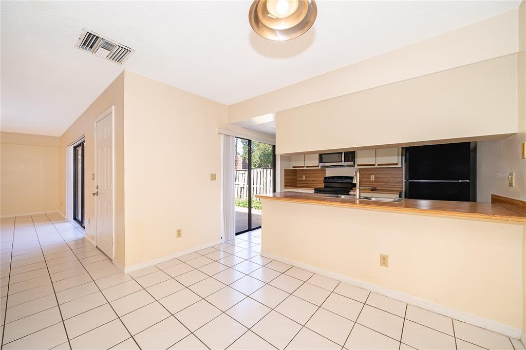5258 Coral Court, Unit 605 Orlando, FL 32811 - Photo 14 of 41 a living room with furniture