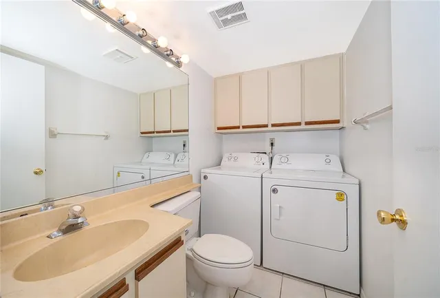 a view of bathroom with a sink toilet and a mirror