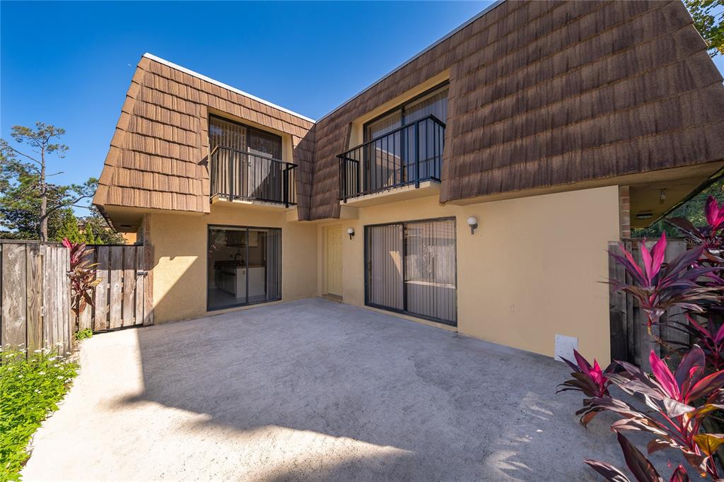 5258 Coral Court, Unit 605 Orlando, FL 32811 - Photo 3 of 41 a view of a house with a garage