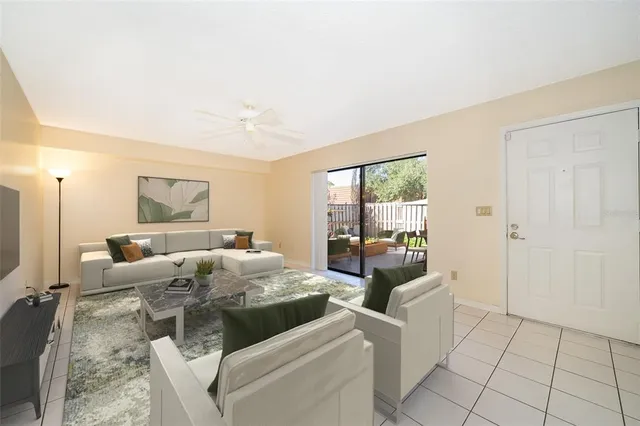 a living room with furniture and a large window