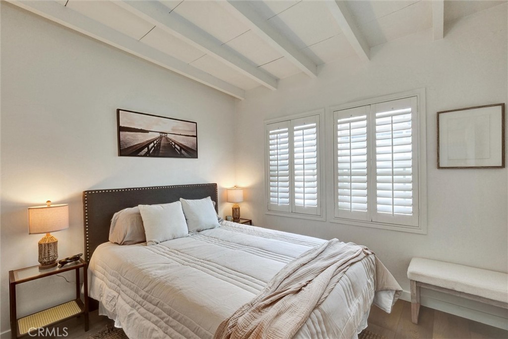 1401 West 165th Street Compton, CA 90220 - Photo 15 of 31 a bedroom with a bed and a window