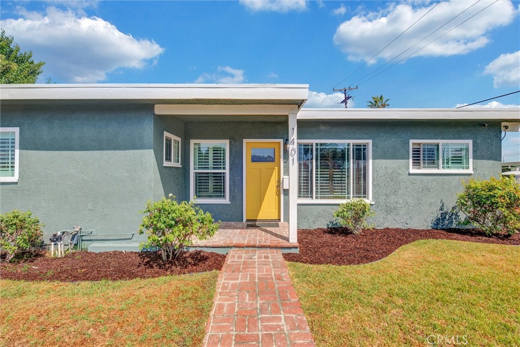 1401 West 165th Street Compton, CA 90220 - Photo 2 of 31 a front view of a house with garden